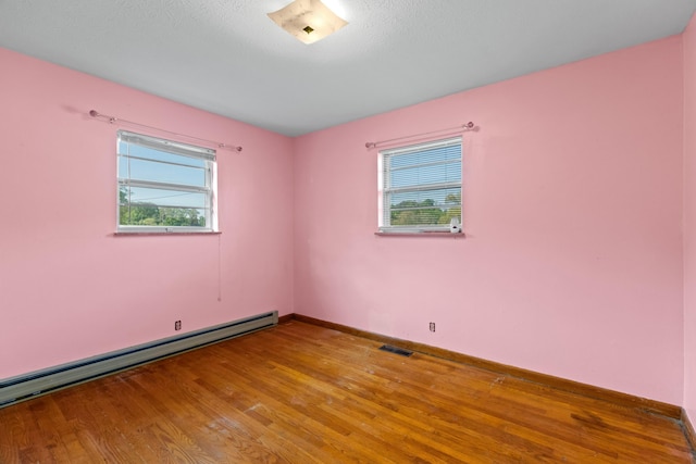 2757 Bethel Rd, Morristown, TN 37813 - unfurnished room with a baseboard radiator, wood finished floors, and baseboards