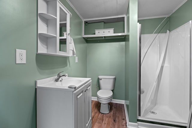 2757 Bethel Rd, Morristown, TN 37813 - bathroom with wood finished floors, a shower stall, toilet, vanity, and ornamental molding
