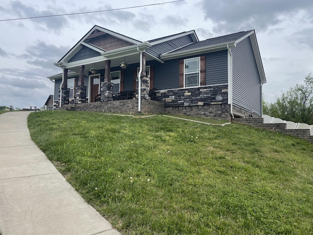 craftsman-style home with a porch and a front yard