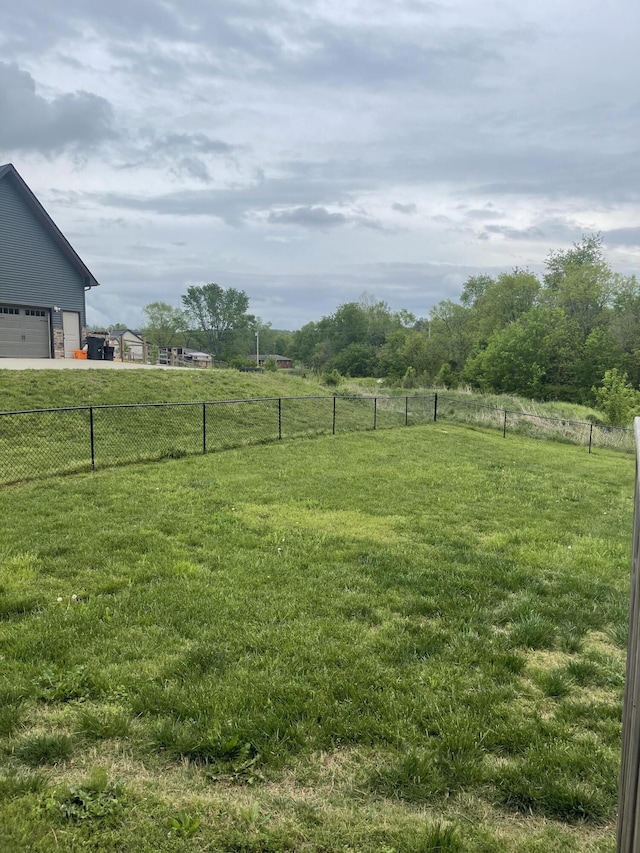 view of yard featuring a rural view and fence