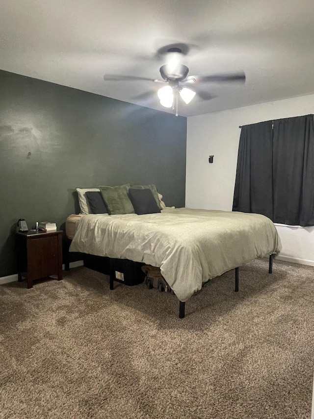 bedroom with a ceiling fan and carpet