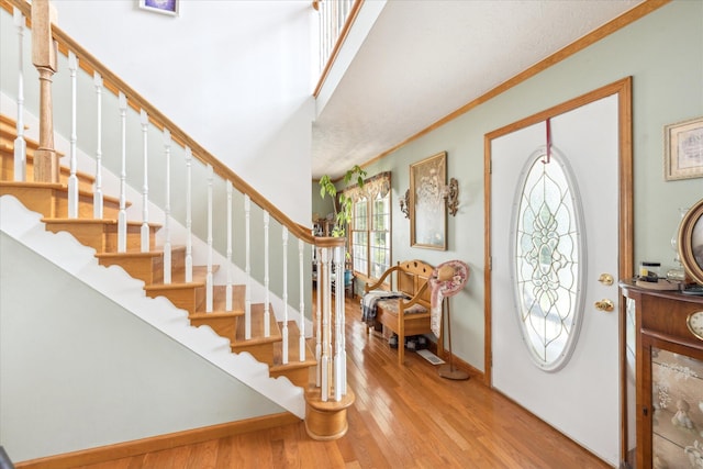 2895 Looney Rd, Parrottsville, TN 37843 - entrance foyer with stairs, light wood-style flooring, baseboards, and ornamental molding