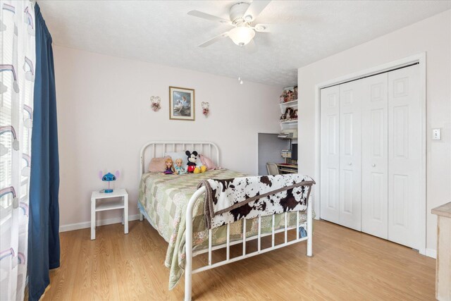 2895 Looney Rd, Parrottsville, TN 37843 - bedroom with light wood finished floors, a closet, baseboards, and a ceiling fan