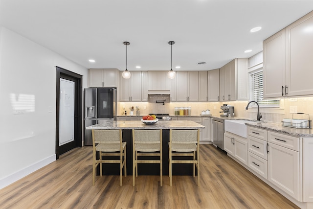 300 Victor Ln, Whitesburg, TN 37891 - kitchen with a sink, stainless steel appliances, backsplash, light wood finished floors, and recessed lighting