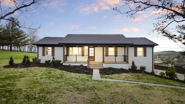 300 Victor Ln, Whitesburg, TN 37891 - view of front facade featuring a porch, brick siding, and a lawn