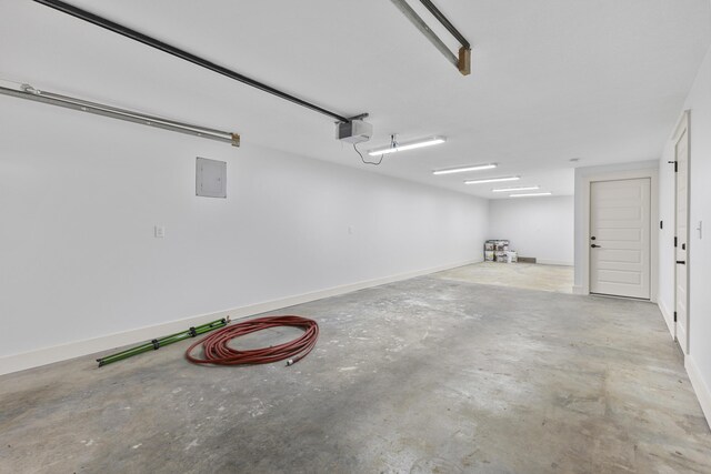 300 Victor Ln, Whitesburg, TN 37891 - garage featuring a garage door opener and electric panel
