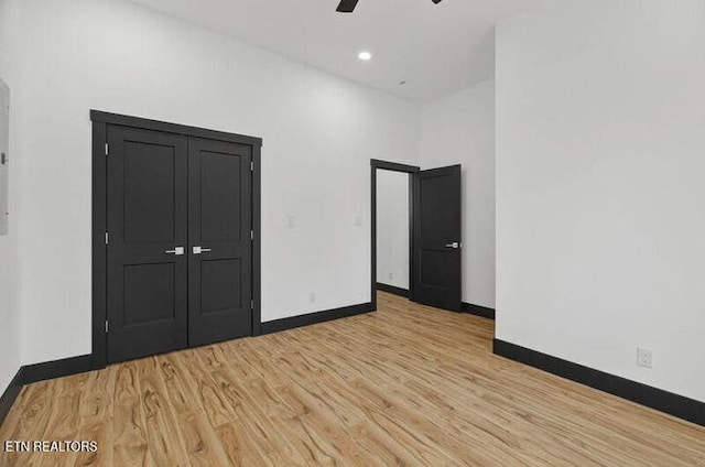 1570 W Dumplin Valley Rd, Dandridge, TN 37725 - unfurnished bedroom with light wood-type flooring and ceiling fan