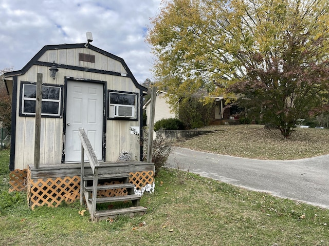 view of outbuilding with a yard