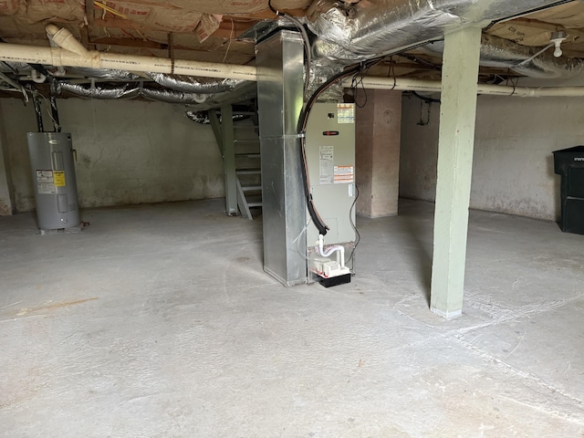 unfinished below grade area with heating unit and electric water heater