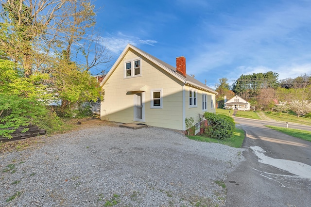 view of home's exterior featuring a chimney
