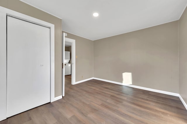 unfurnished bedroom with baseboards, recessed lighting, and wood finished floors