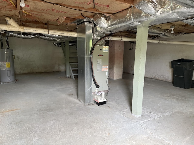 unfinished below grade area featuring heating unit and electric water heater