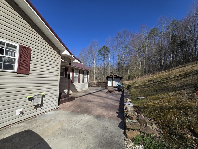 view of patio with an outdoor structure