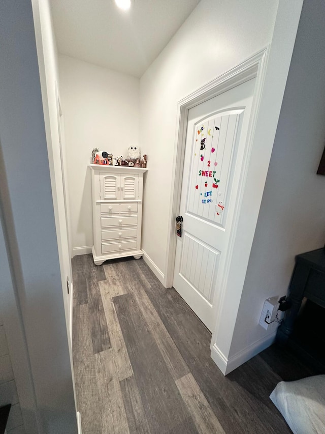 corridor with dark wood-type flooring