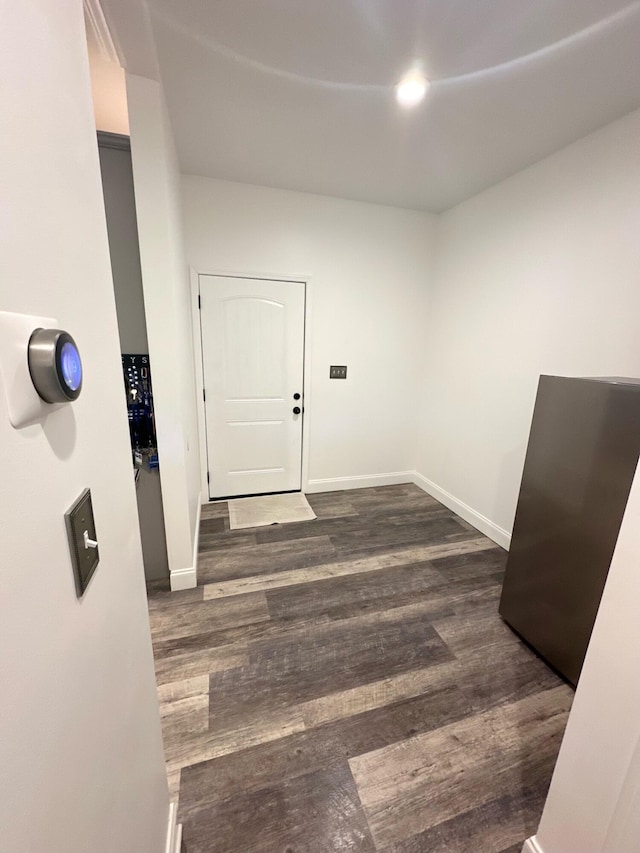 corridor with dark wood-type flooring