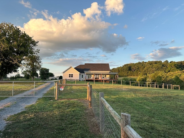 exterior space with a rural view and a lawn