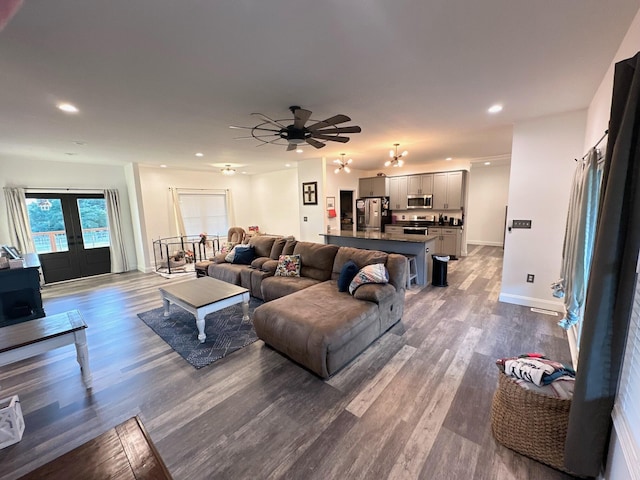 living room with ceiling fan, wood-type flooring, and french doors