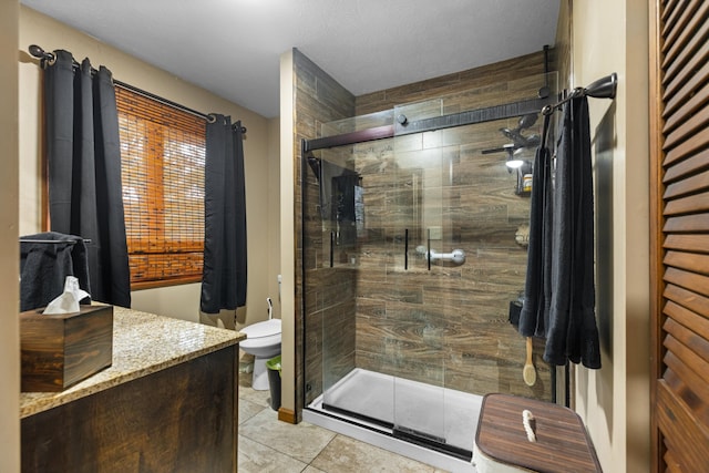 bathroom with walk in shower, tile patterned flooring, and toilet