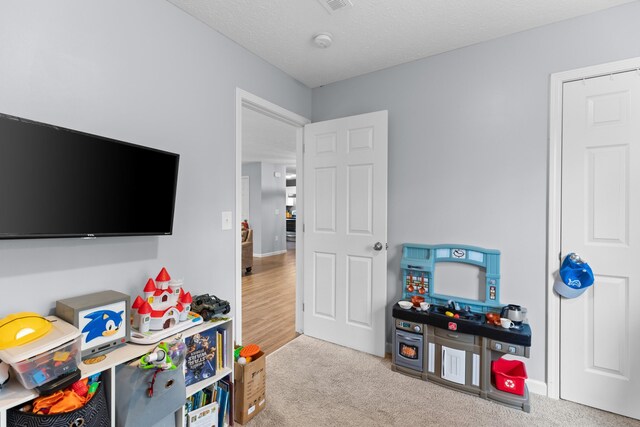 playroom with light colored carpet