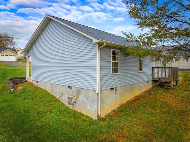 view of side of home featuring a yard