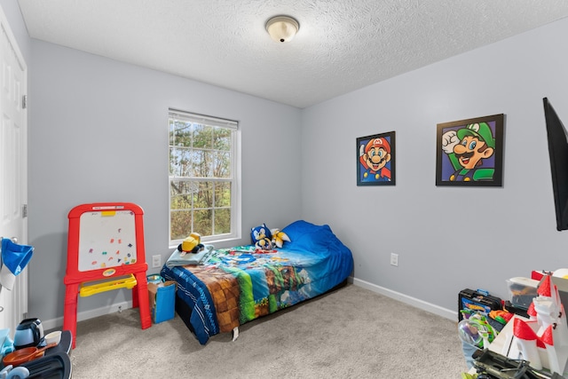 carpeted bedroom featuring a textured ceiling