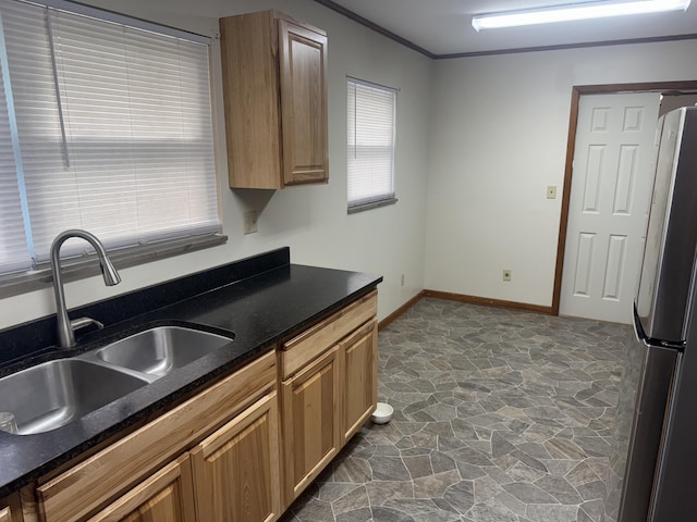 838 Pineridge Rd, Dandridge, TN 37725 - kitchen with freestanding refrigerator, stone floors, and ornamental molding