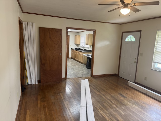 838 Pineridge Rd, Dandridge, TN 37725 - entrance foyer featuring dark wood finished floors, ceiling fan, and ornamental molding
