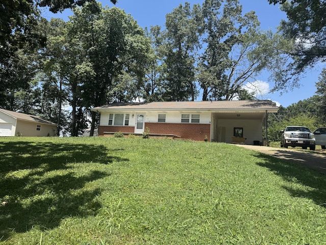 838 Pineridge Rd, Dandridge, TN 37725 - ranch-style house featuring brick siding, a front lawn, and a carport