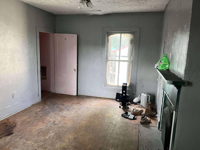 207 E 2nd N St, Morristown, TN 37814 - bedroom with a textured ceiling and baseboards