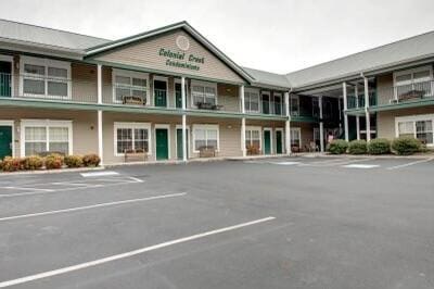 view of property featuring uncovered parking