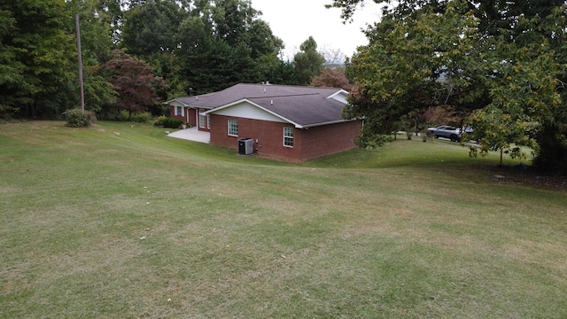 view of yard with central air condition unit