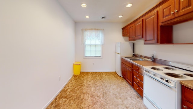 kitchen with sink and white appliances