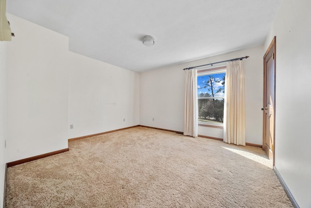 empty room featuring light colored carpet