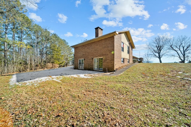 view of property exterior featuring a yard