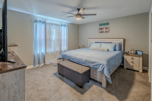 bedroom with ceiling fan and carpet floors