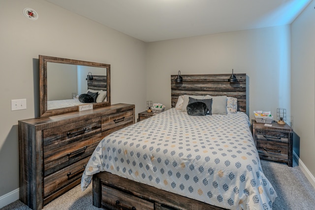 bedroom with light colored carpet