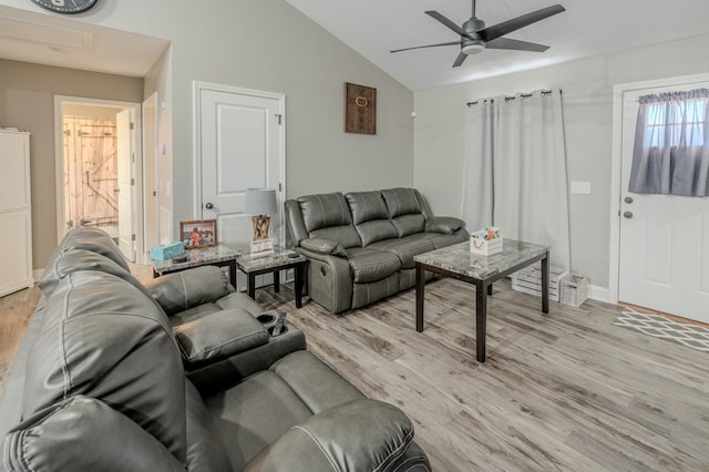 living room featuring light wood-type flooring, ceiling fan, and lofted ceiling