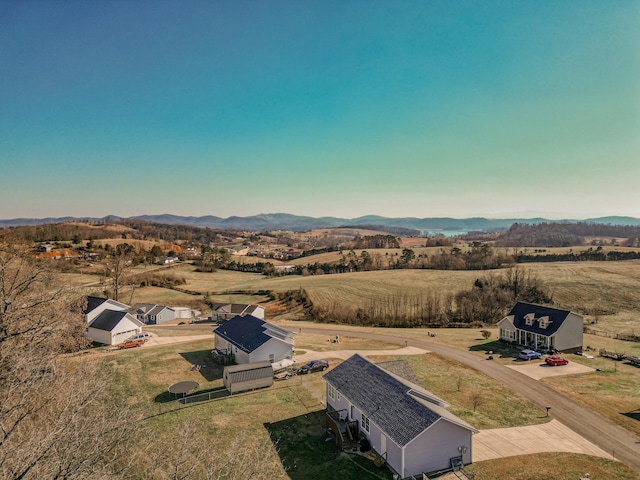 birds eye view of property with a mountain view