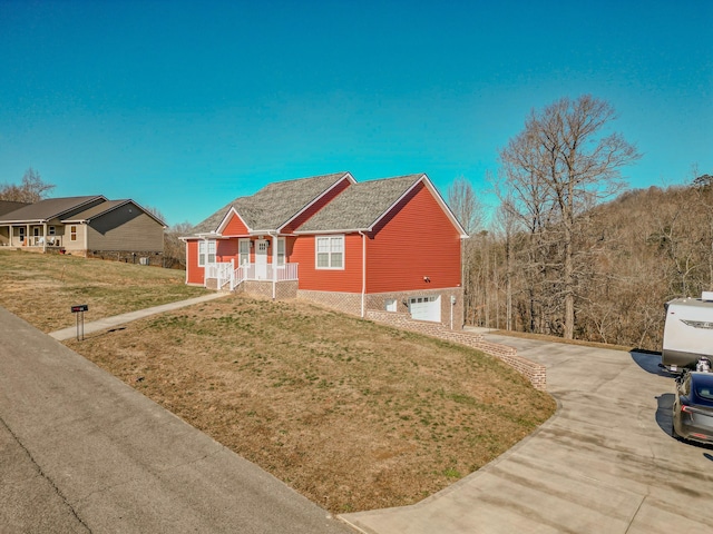 view of front of property featuring a garage and a front yard