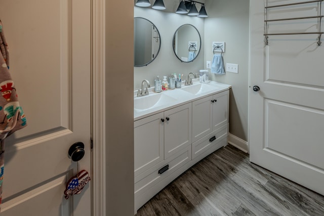 bathroom featuring hardwood / wood-style floors and vanity