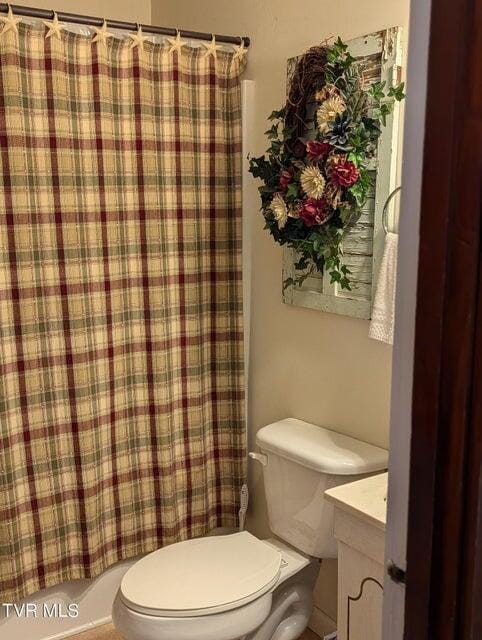 full bathroom featuring vanity, toilet, and shower / bathtub combination with curtain