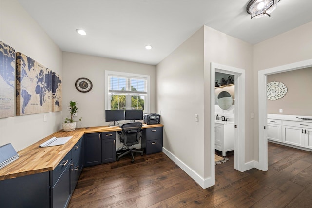 office space with sink and dark hardwood / wood-style floors