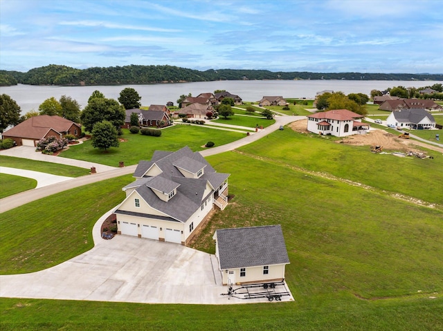 drone / aerial view with a water view