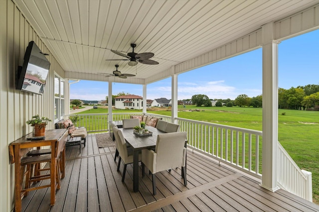 sunroom / solarium with ceiling fan