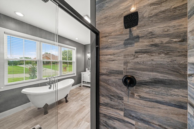 bathroom featuring separate shower and tub