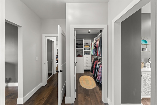 corridor featuring dark hardwood / wood-style flooring