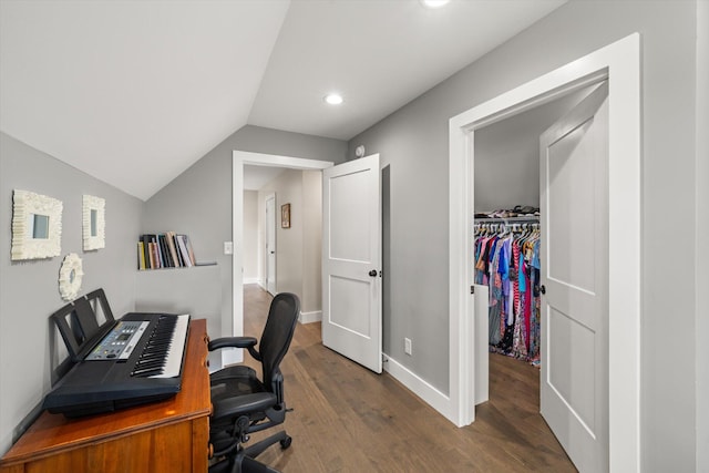 office space featuring dark wood-type flooring and vaulted ceiling