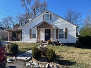 bungalow-style house with a front lawn