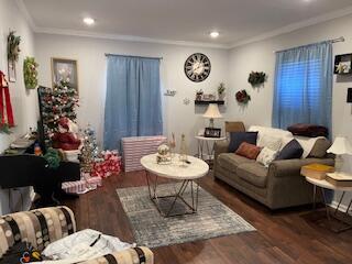 2115 Eastview Ave, Jefferson City, TN 37760 - living room featuring dark hardwood / wood-style flooring and crown molding