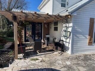 view of patio featuring a pergola